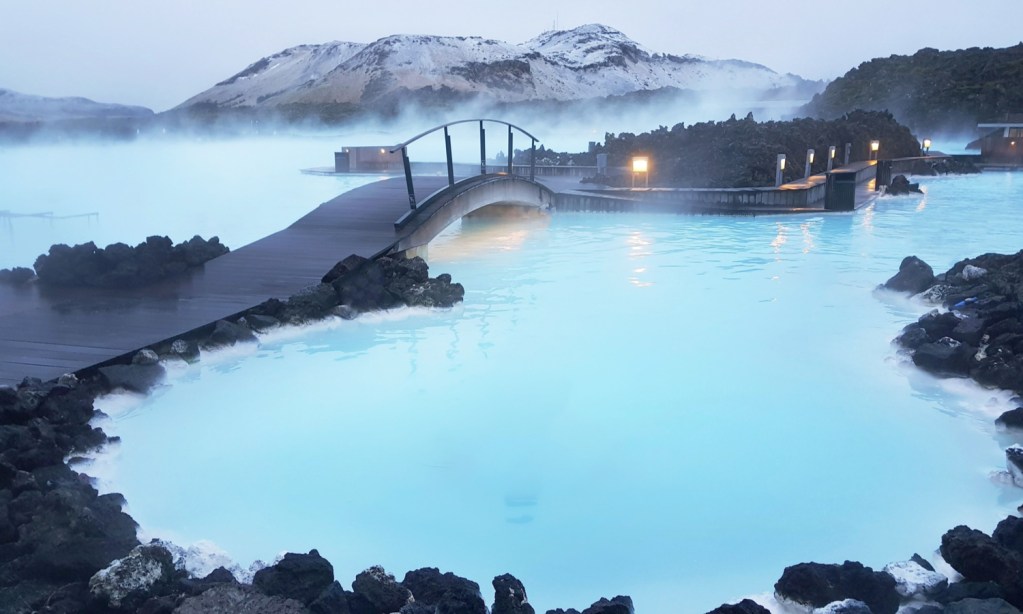 Milky blue waters of the hot springs at Blue Lagoon, Iceland - Luxury Escapes 