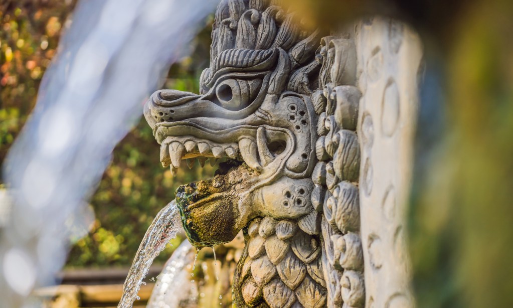 Water fountain shaped like a Balinese dragon at Banjar Hot Springs - Luxury Escapes 
