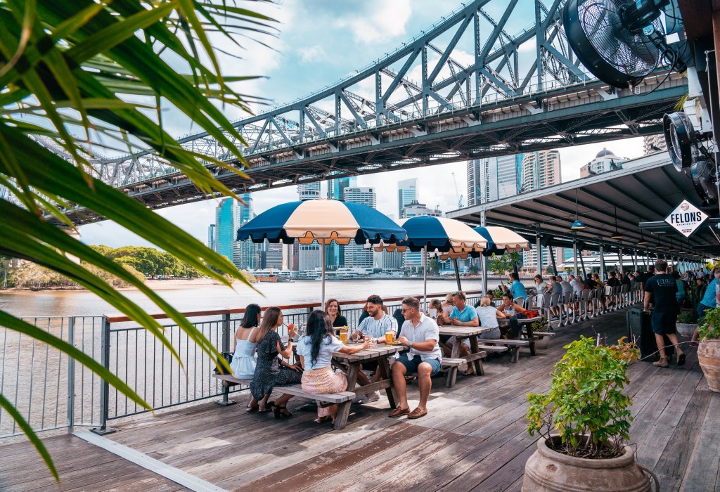 People eating and drinking at Howard Smith Wharves, a must-visit destination perfect for a two-day itinerary in Brisbane