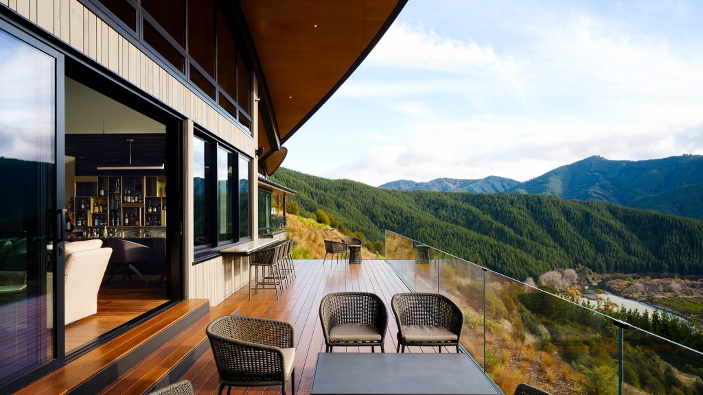 The outdoor deck with a view at Falcon Brae Villa in Stanley Brook, one of New Zealand's best boutique hotels