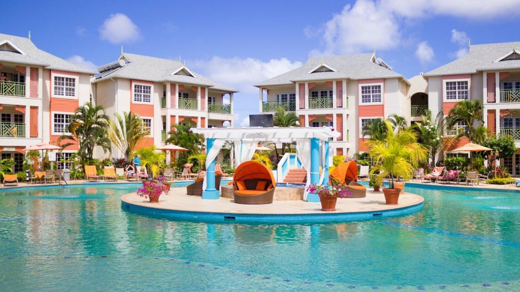 The pool at Bay Gardens Beach Resort & Spa, St Lucia, home to the island's largest water park - Splash Island Water Park - Luxury Escapes