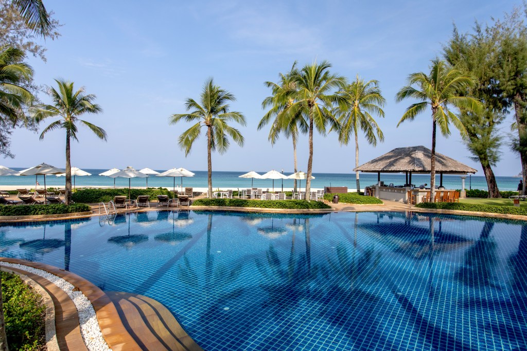 The view overlooking Katathani Phuket Beach Resort oceanfront pool, one of The Best Family Resorts in Phuket - Luxury Escapes