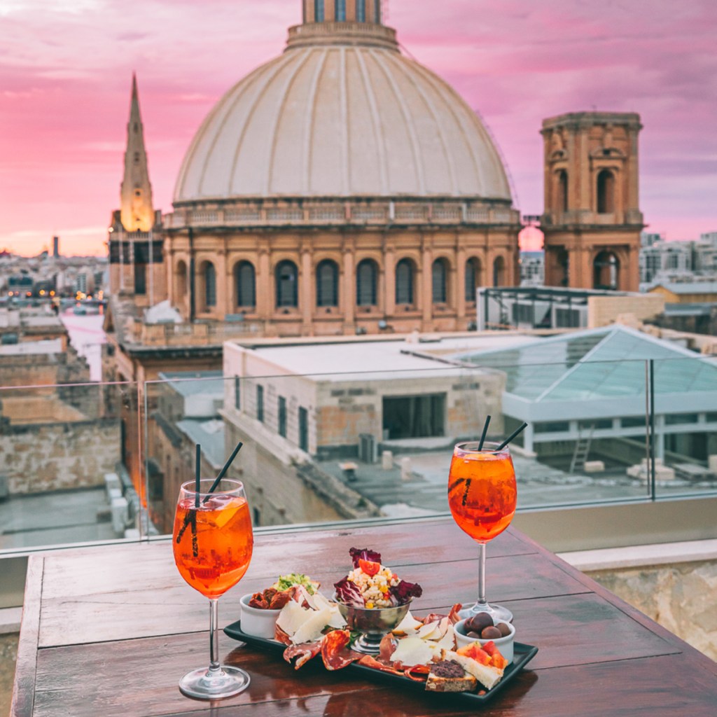 Sip on wine from a rooftop in Valletta and soak up the charming energy of the city – Luxury Escapes