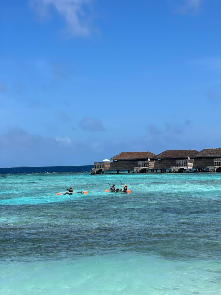 Glass bottom canoes in the lagoon at Kagi Maldives Spa Island, a unique experience in the Maldives 