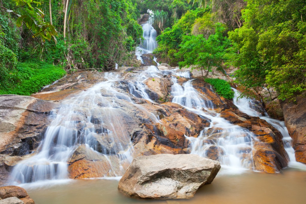 Na Muang Waterfall in Koh Samui, one of the best things to do in Koh Samui - Luxury Escapes