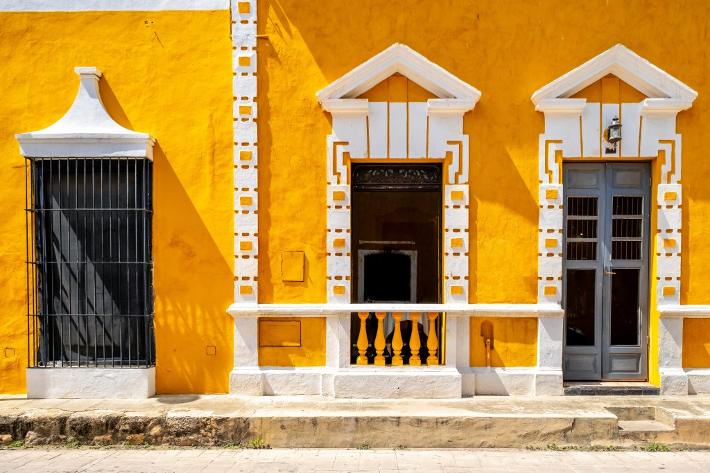 A captivating shot of the Gold city of Izamal, Mexico - Luxury Escapes