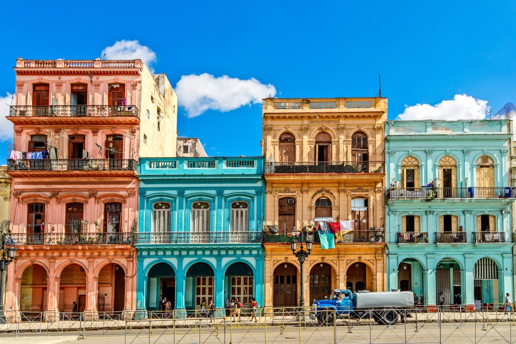 Colourful houses in Cube, one of the Top Bucket-List Destinations for 2023 - Luxury Escapes 
