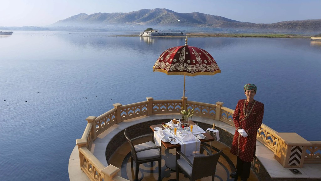 Looking out over the lake at Sheesh Mahal, The Leela, one of the world's most romantic restaurants