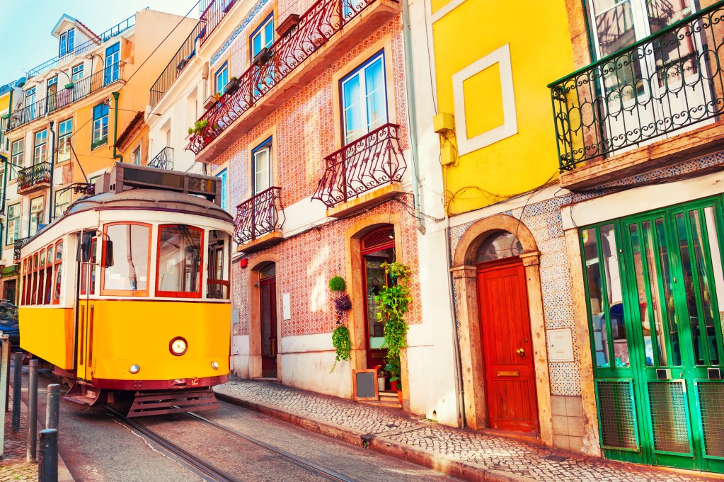 The hilly route of Lisbon's number 28 tram is just one of the many wonders that await solo travellers in Portugal - Luxury Escapes