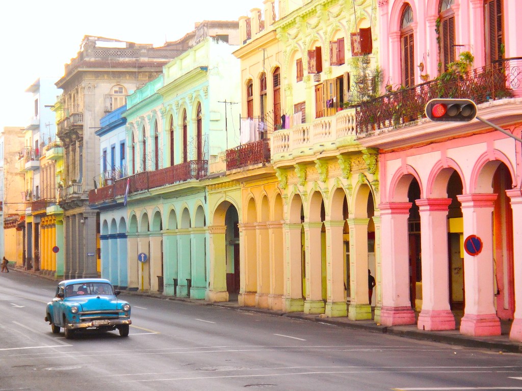 The kaleidoscopic colours and vintage cars of Havana are just some of the many wonders that await solo travellers in Cuba - Luxury Escapes