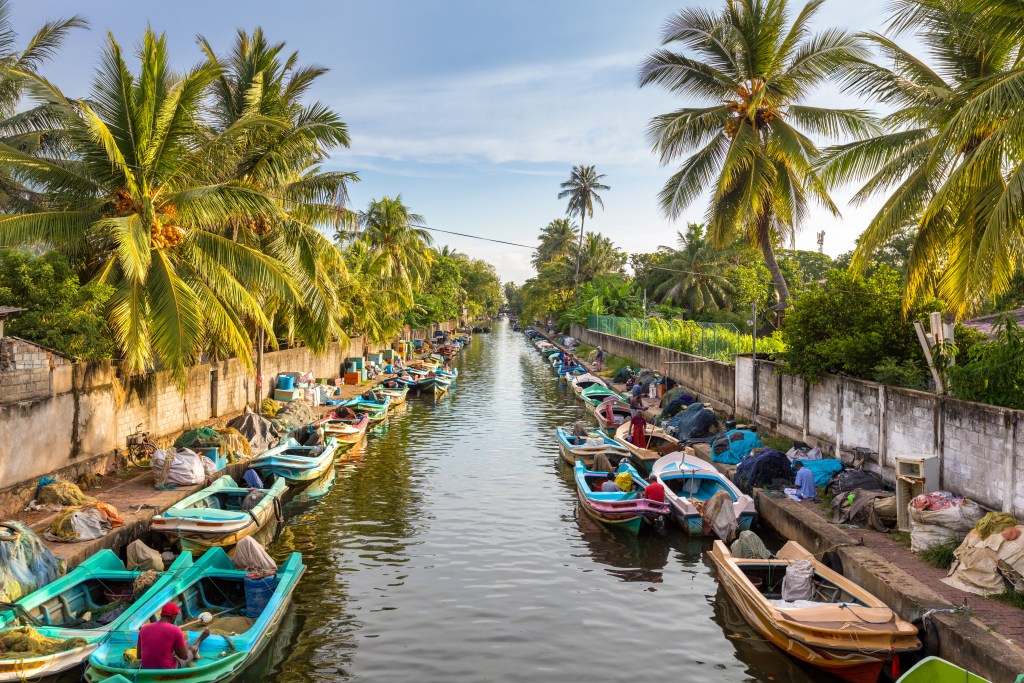 A canal in Negombo, home to one of Sri Lanka's best beaches - Luxury Escapes 
