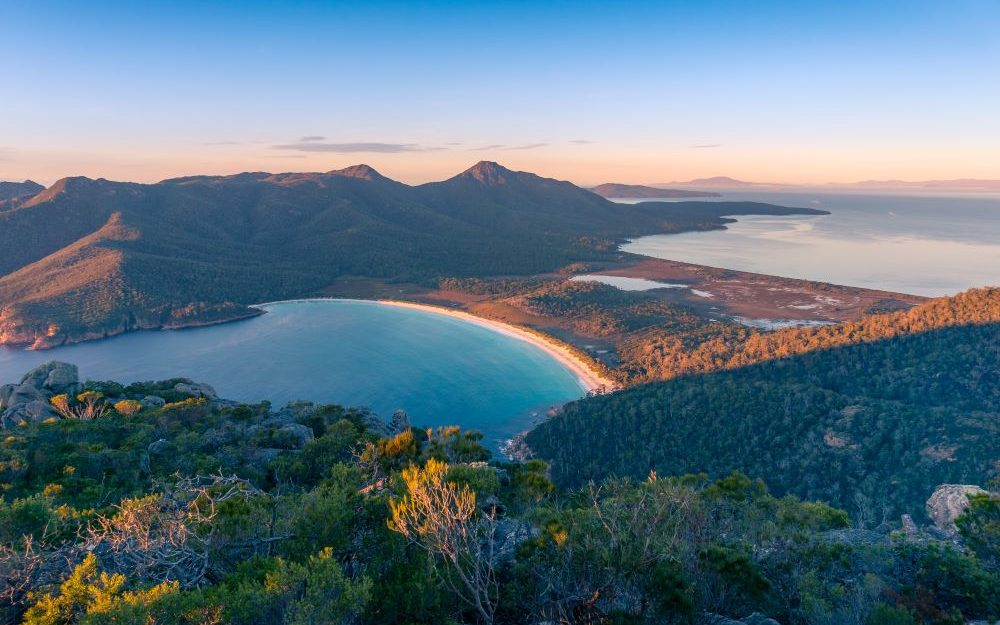 birds-eye view of Wineglass Bay, one of the top 10 beaches in the world - Luxury Escapes 