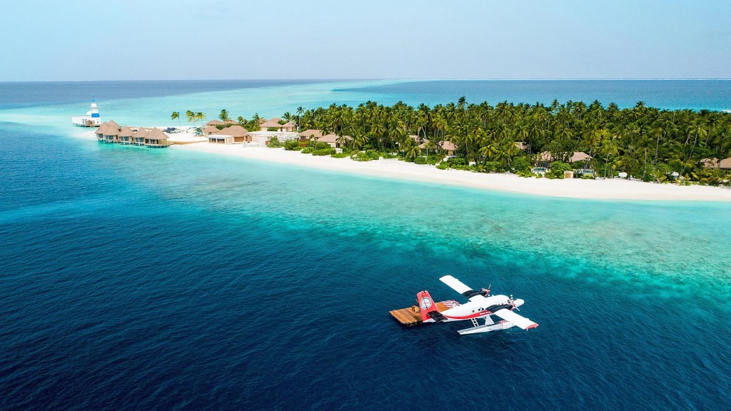 Seaplane arrival to the Intercontinental Maldives Maamunagau, one of the most luxurious resorts in the Maldives - Luxury Escapes