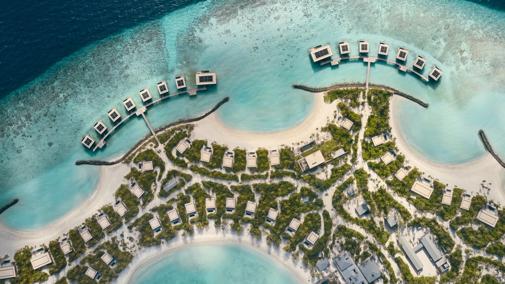 Aerial view of the Patina Maldives resort, one of the most luxurious resorts in the Maldives - Luxury Escapes