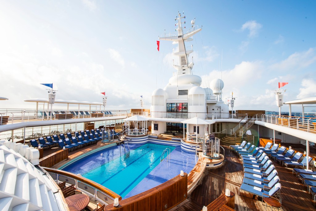 A tranquil haven for adults the Quiet Cove Pool onboard the Disney Wonder promises relaxation, to illustrate why you should book with Disney Cruise Line for 2024 - Luxury Escapes