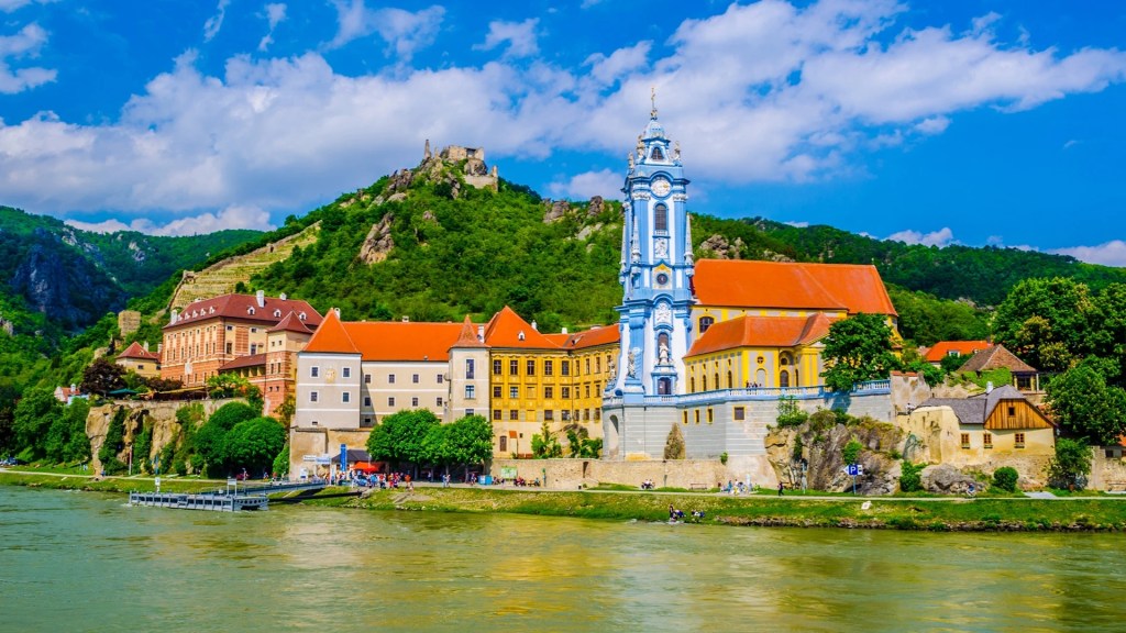 A Riverside Luxury Cruise glides through iconic European waterways and ports including Durnstein, Austria.