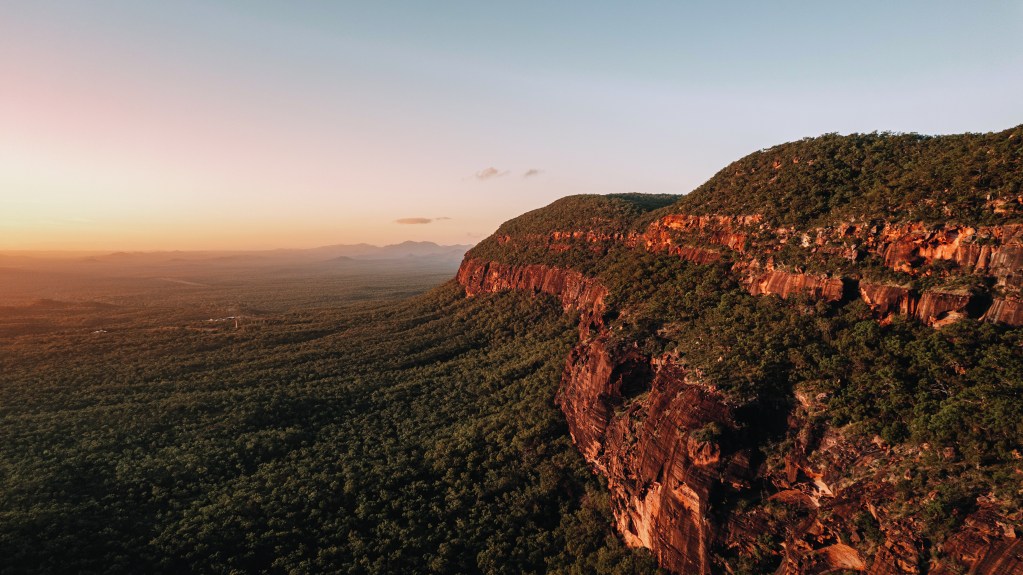 Sunrise over Mount Mulligan and the wilderness, just 150km north-west of Cairns - Luxury Escapes