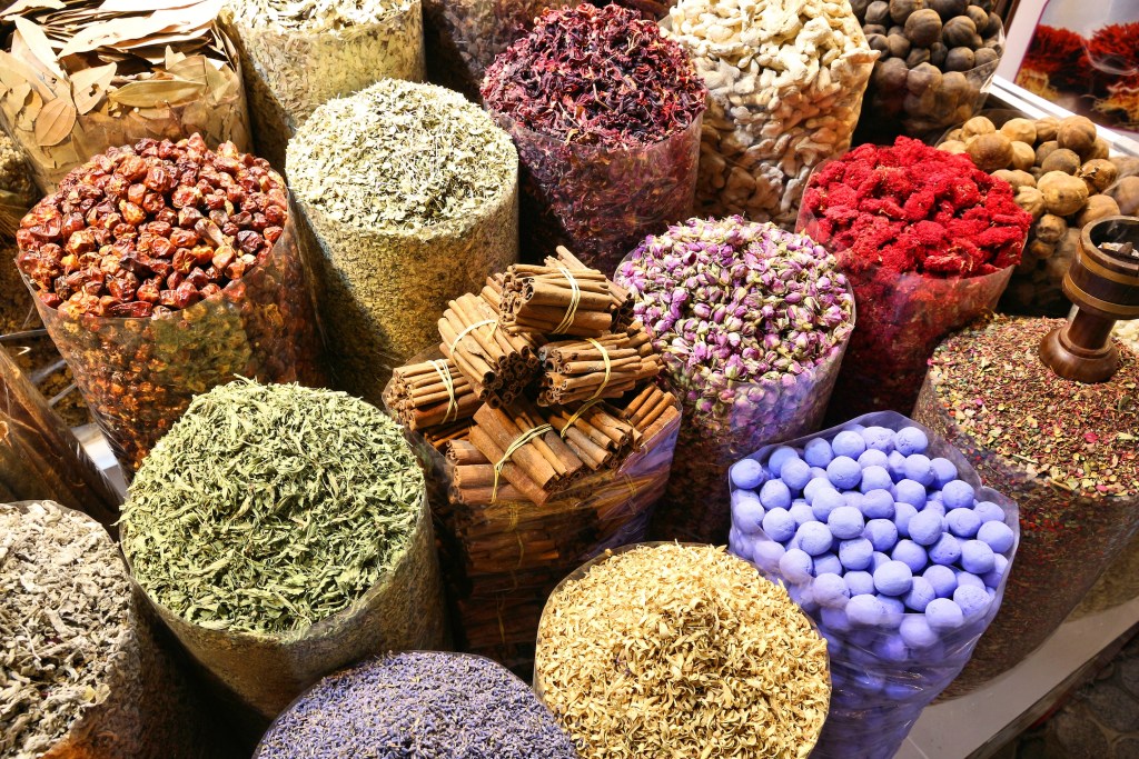 An array of colourful herbs and spices at the Spice Souk in Old Dubai, one of the best foodie destinations in Dubai - Luxury Escapes