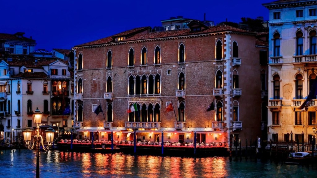 The Venetian styled palace facade of The Gritti Palace overlooking the canals which is one of the most extraordinary heritage hotels - Luxury Escapes